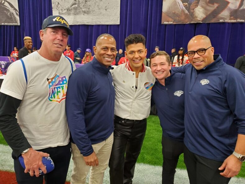 Jonathan Romero (center) with members of the National Gay Flag Football League.