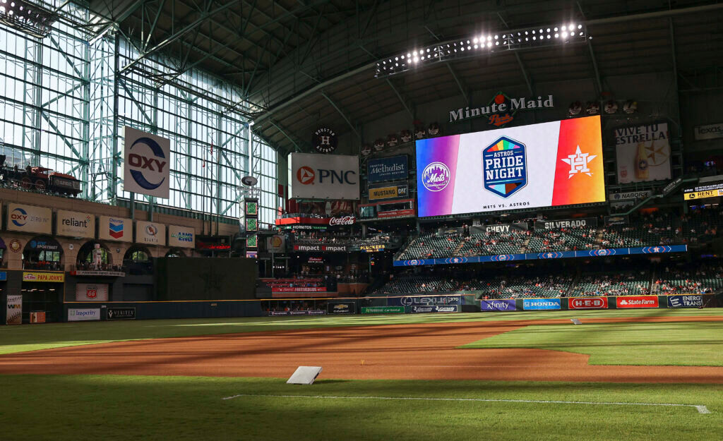 A baseball park prepares for Pride promotion.