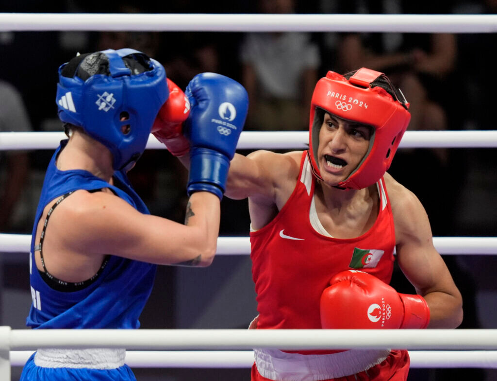 Imane Khelif punches an opponent in the boxing ring