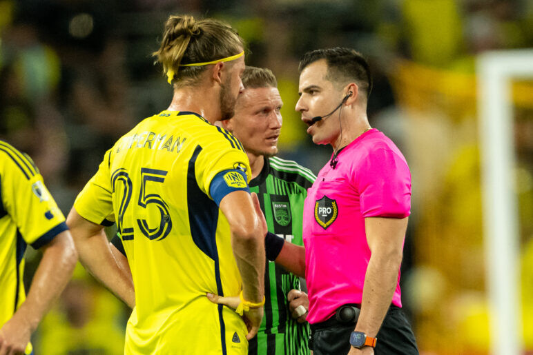 Nashville SC's Walker Zimmerman, Austin FC's Alexander Ring and referee Rosendo Mendoza