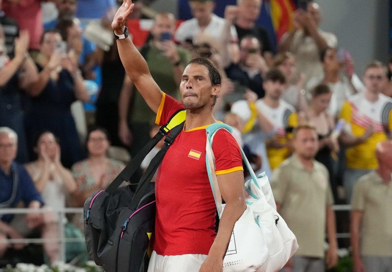 Rafael Nadal waves to the crowd as he leaves the court during the Paris Olympics.