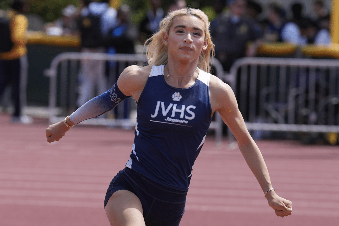 girl runs with her arms out