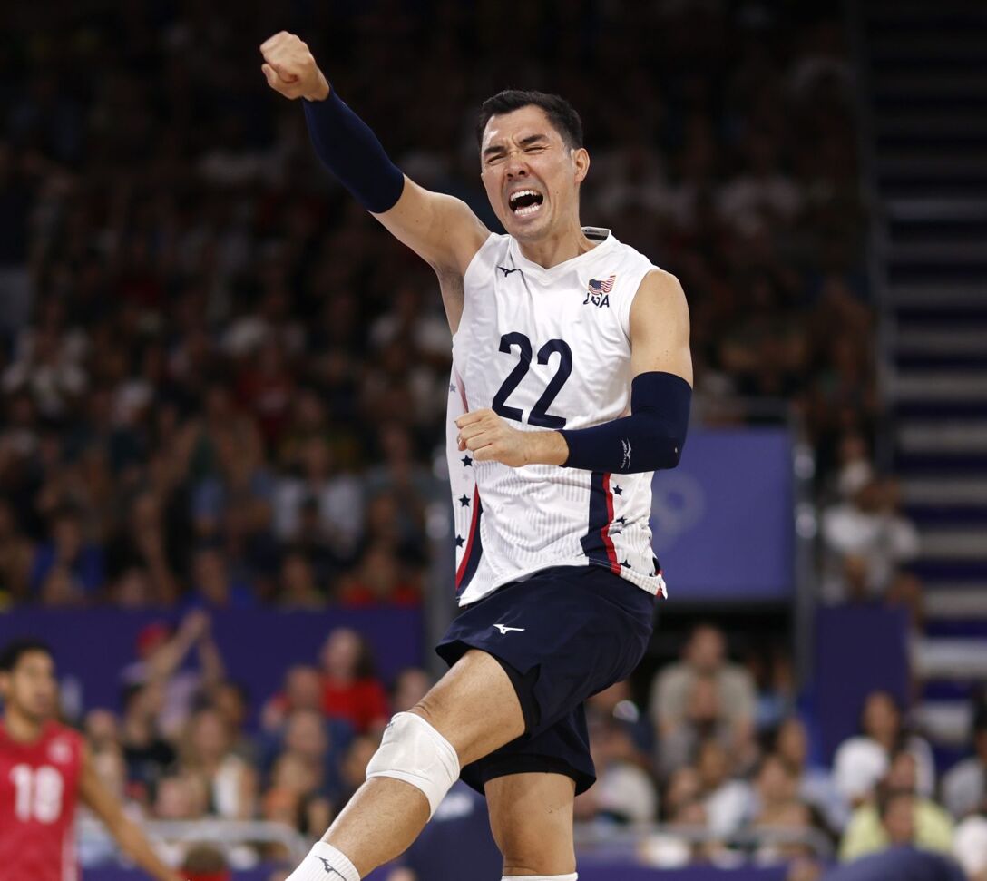 United States libero Erik Shoji (22) celebrates against Brazil during the Paris 2024 Olympic Summer Games.