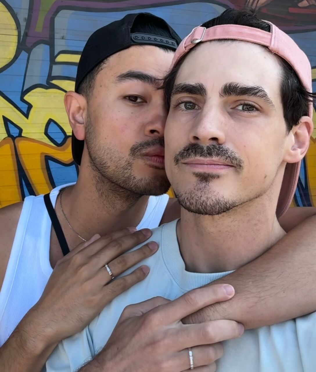 Paul Poirier is kissed on the cheek by his boyfriend, Kevin.