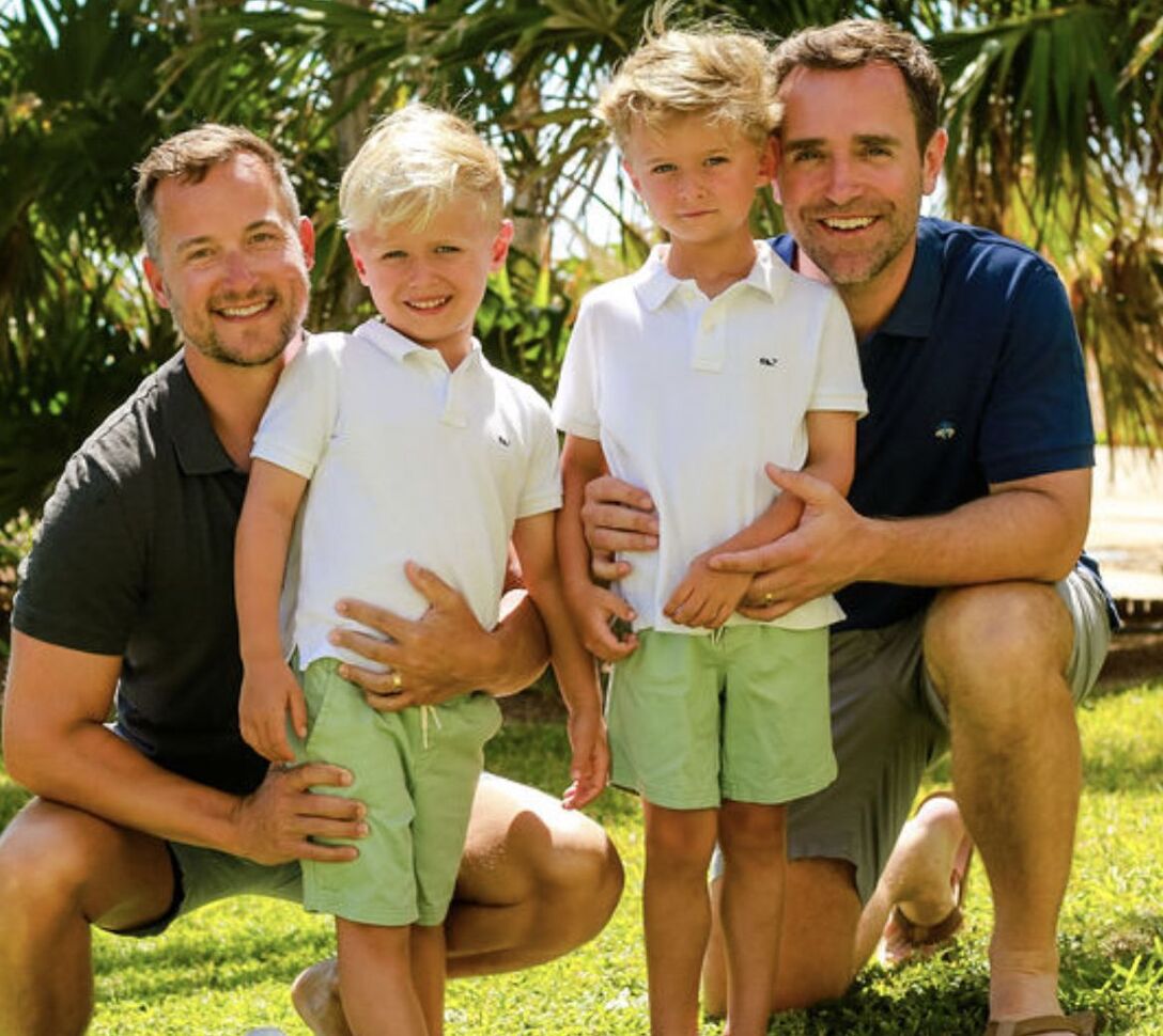 USTA President Brian Vahaly, right, poses with husband, Bill Jones, and their twins, Parker and Bennett.